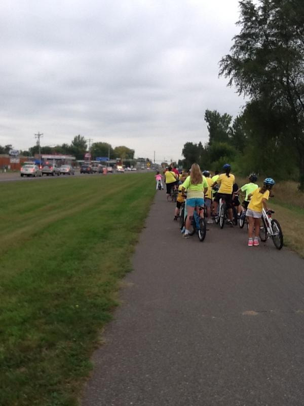 5th Graders biking to Hugo to read to our K and 1 students!