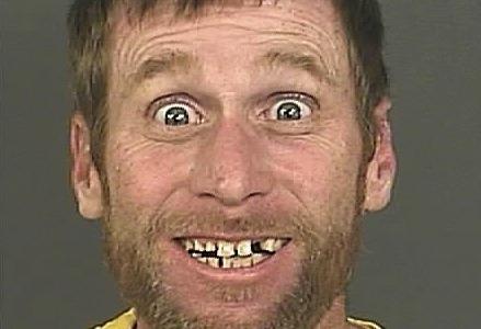 mashable's tweet image. Bank robbery suspect has world's happiest mug shot on.mash.to/1ry3Y1m