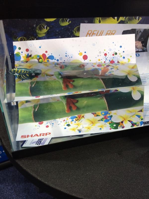 RelycoSales's tweet photo. Having fun with #Sharp at #GraphExpo booth 2048 testing #REVLAR waterproof paper http://t.co/Wyppr7YqM9