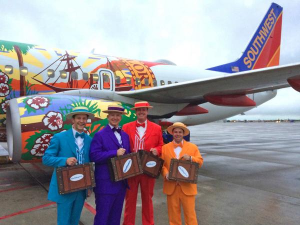 WaltDisneyWorld's tweet photo. Dapper Dans @ @DallasLoveField w/ the "Florida" plane we boarded. (h/t to Adam @ @SouthwestAir) ^GB #DisneySide http://t.co/HFQgJZ0irU