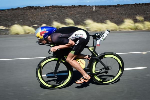 TriathleteMag's tweet photo. Don't try this at home. @SebastianKienle gets as aero as possible while riding his way to the #IMKona victory. http://t.co/Xb8TRie6K5