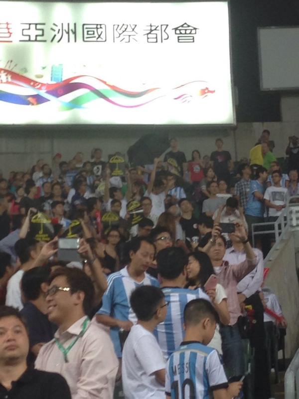 Timmy_Of_SP's tweet photo. At the ARG vs HKG game. The PRC anthem is booed as yellow flags and #umhk folks make their voices heard. http://t.co/bfi7cf5AYc
