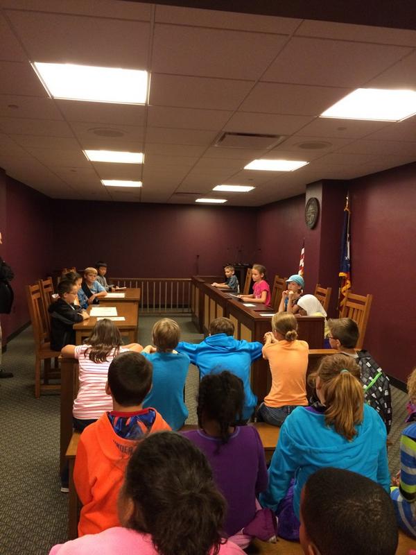 Students are participating in a mock trial based on Harry Potter.