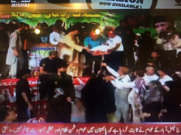 jameelajmal2's tweet photo. "@Usmani111: #DrQadri distributing relief packages to flood victims #ImTheRevolution #PAT http://t.co/caSI76jdCA"