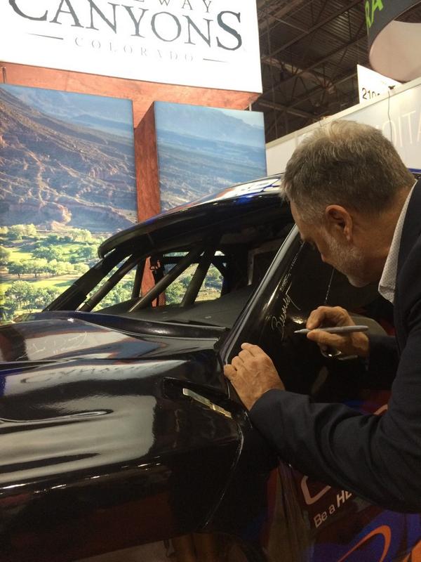 gatewaycanyons's tweet image. Russell Harris signing the Pro Baja Race Truck for "Driving to Fight Cancer" #IMEX14 #drivenEXP #gatewaycanyons