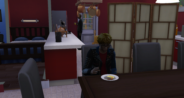 Ashton is eating alone and laughing to himself...