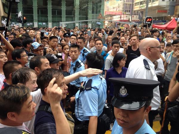 Police separate pro-Beijing supporters + student protestors. Angry residents denounce foreign media  4 'interfering'