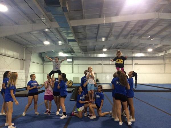 Some stunting happening today at sunshine rays practice 💙💚☀️