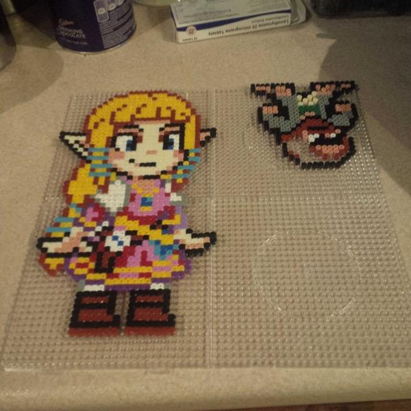 tetley75's tweet image. Maddy has dropped a Hama bomb on my pitiful efforts...mine is the unfinished Dude in the corner #zelda #8bitheroes