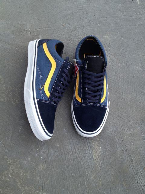 blue vans with yellow stripe