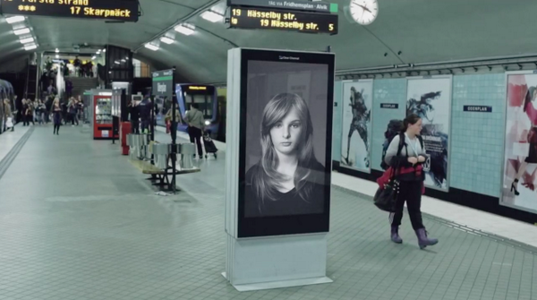 Adweek's tweet photo. Another subway ad blows a woman's hair around as trains arrive, but there's a twist. http://t.co/RoHVXMVao8 http://t.co/FvCm6wjIhO