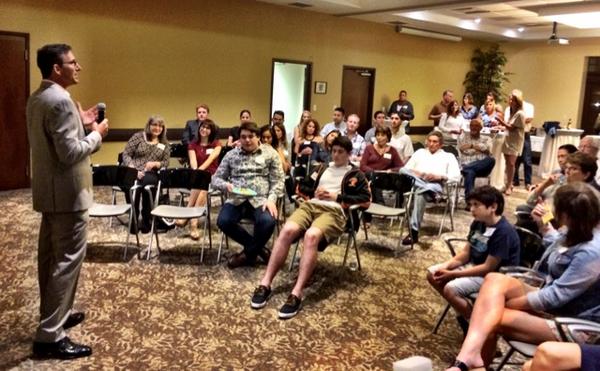 ThinkCreativeFL's tweet photo. Mark addressing the crowd at our #hotelimpossible viewing party. http://t.co/tpAqK4QVbY