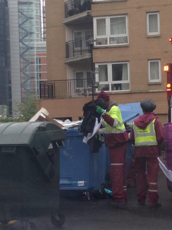 Bin men going through the bins for a new shirts for the weekend WTF