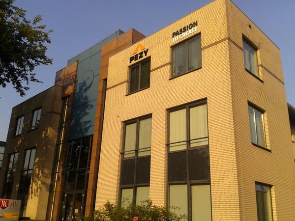 PezyPI's tweet photo. The new office of Pezy Eindhoven, just opposite the famous Evoluon building. Clearly visible for each and everyone! http://t.co/ci8gnigSr7