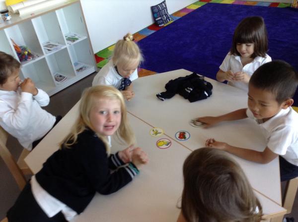 KG French class using 'le nez' to identify smells of various fruits