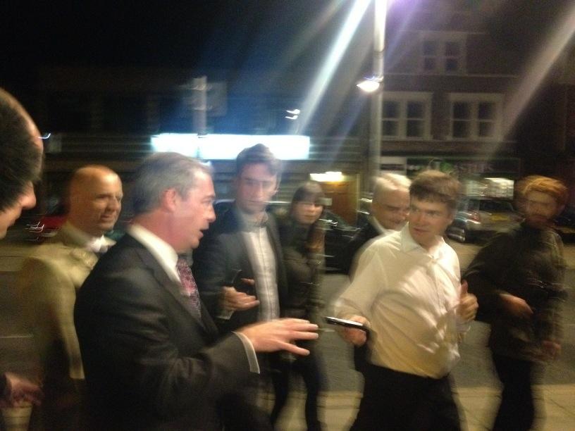 Nigel arrives. His message to David Cameron: Happy Birthday. 