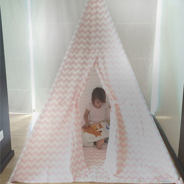 DomesticObjects's tweet image. Quiet hideaway for reading a book #DomesticObjects #teepee #pink #chevron #playtent