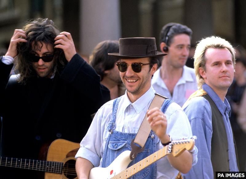 Happy 61st birthday to Midge Ure, seen here wearing a hat and hanging out with a Boomtown Rat and a Howard Jones. 