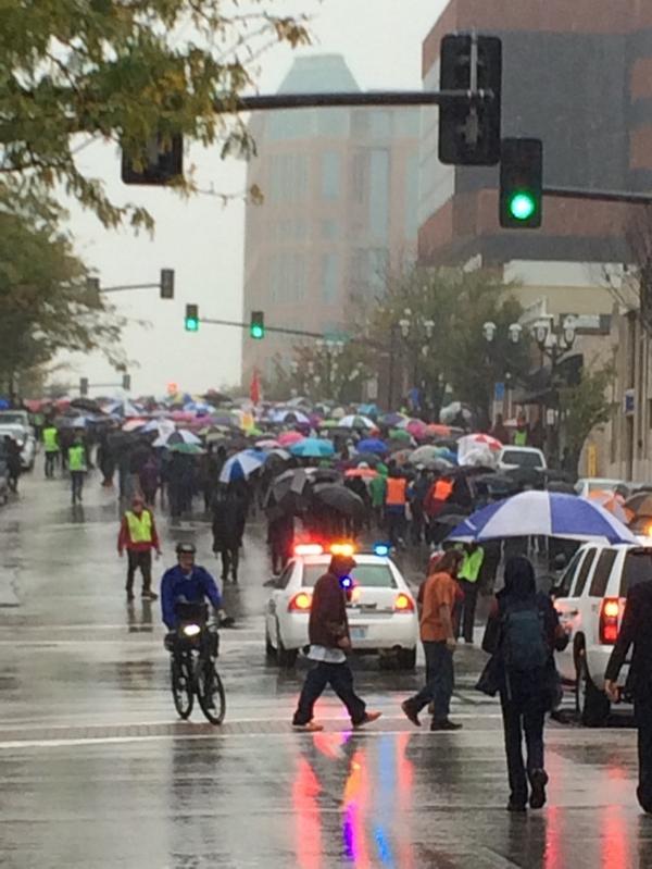 brookeminters's tweet photo. Marching thru Clayton. People chanting "shut it down for mike brown". #fergusonoctober http://t.co/0igqKpsCav