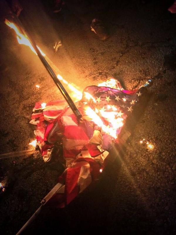 AndyBuhr's tweet photo. #FergusonTerrorists plan #FergusonOctoberTerrorism violent #HateMobs viral #Vandalism #FlagBurning "'protests" in STL http://t.co/aF4eSoWnOZ