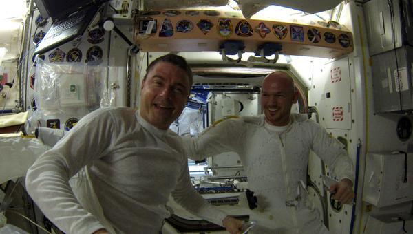 Astro_Alex's tweet photo. Two very happy (but somewhat tired) astronauts after their walk on the wild side @astro_reid #EVA27 http://t.co/IweR3dij2j