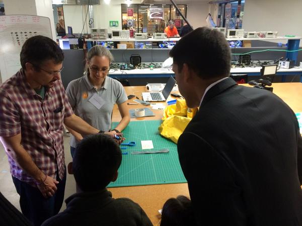 .<a href="/USAID/">USAID</a>'s <a href="/rajshah/">Dr. Rajiv J. Shah</a> examines arduino based sensor for temp &amp; humidity to use in #PPE for worker safety #FightingEbola