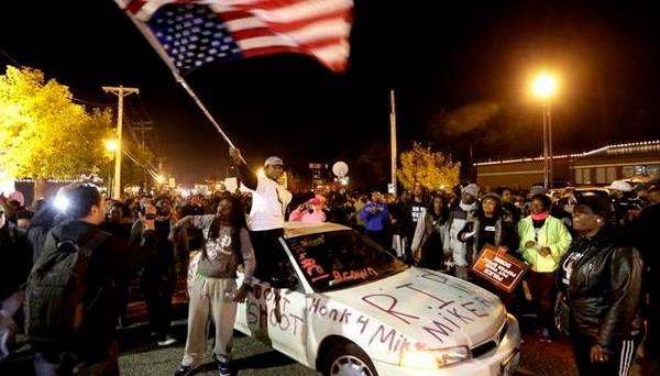 #FergusonOctober protesters throw rocks at police