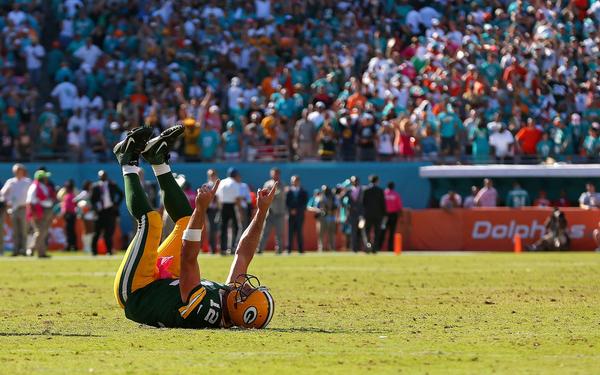 SportsCenter's tweet image. Photo of the Day: Aaron Rodgers after completing the game-winning TD pass with :03 to beat Miami.