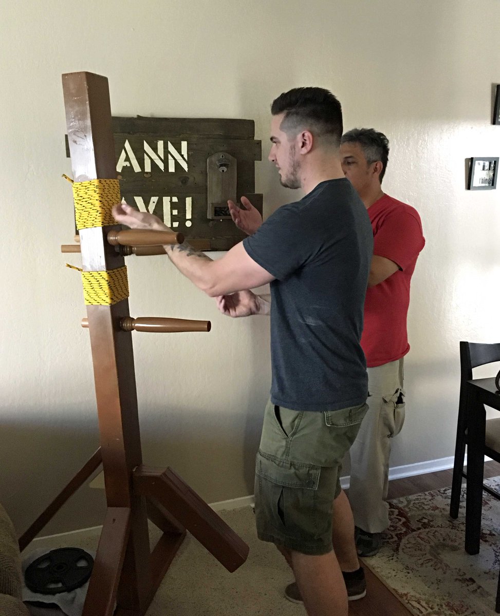 LizAnne1959's tweet photo. Husband/Sifu built my son a Mook Jong. Teaching the first part of the Mook Jong form to my son. I'm so excited! #MookJong #wingchun #kungfu https://t.co/LXMTHmRi6T