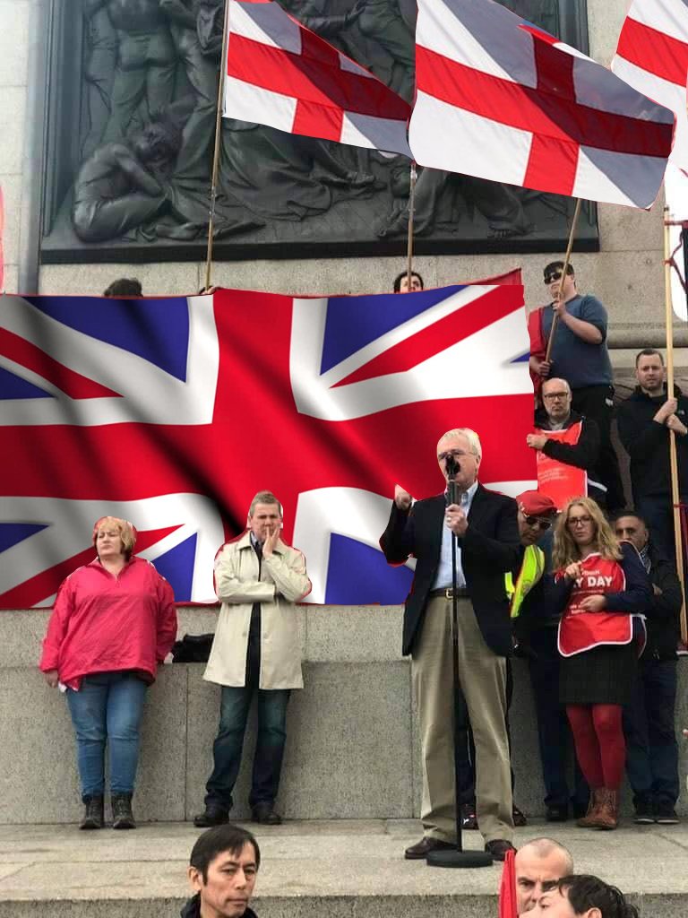 Phillip Hammond holds rally under swastika flags and portraits of saddam hussein C-1fl9UXkAArHj6