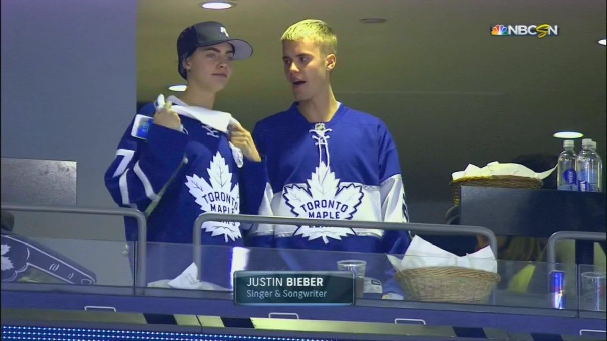 Caraimages's tweet image. April 23: Cara Delevingne with Justin Bieber at the Toronto Maple Leafs game in Toronto.