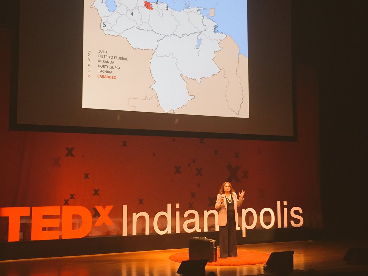 TEDxIND's tweet photo. "Visualize the hope, fear dreams that immigrants bring in this suitcase" Maryori #NaturalHelper @Welcome2Indy #TEDxIndianapolis #Scale https://t.co/hkohE23UT7
