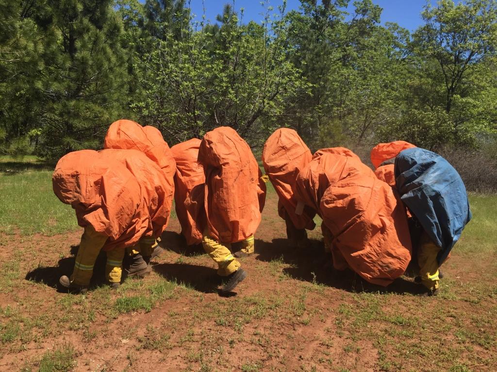 Butte Fire Center corpsmembers practice deploying their fire shelters. They're tested to qualify as Cal Fire crews for 2017 fire season.
