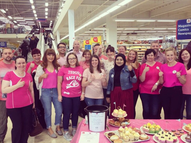 Helping to raise money at Tesco Oldham for Christies Hospital, wearing pink, cake sales, raffle and a prize draw