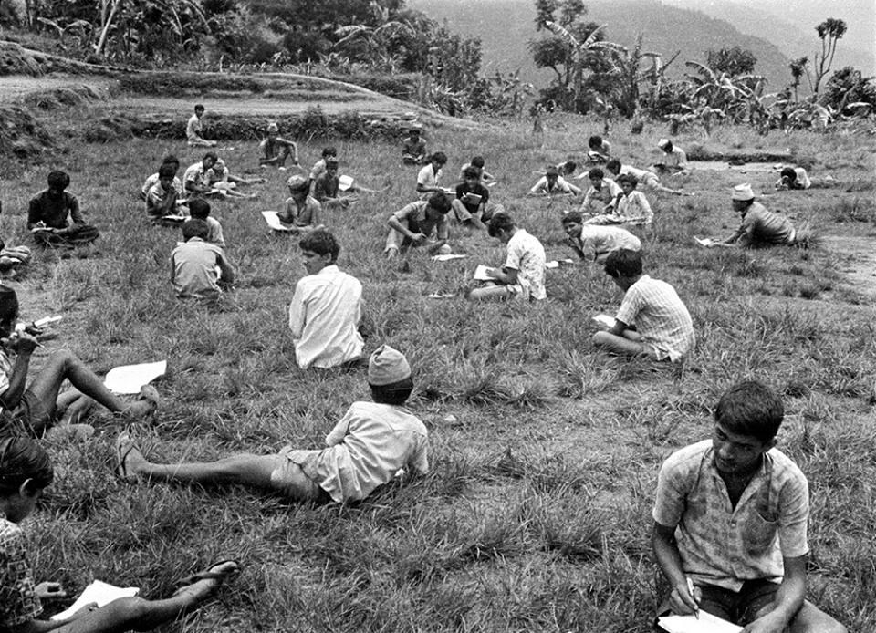 NepalInPix's tweet image. Nepali youths giving Lok Sewa Aayog exams on a sunny chaur in Lamjung in 1975. #Nepal