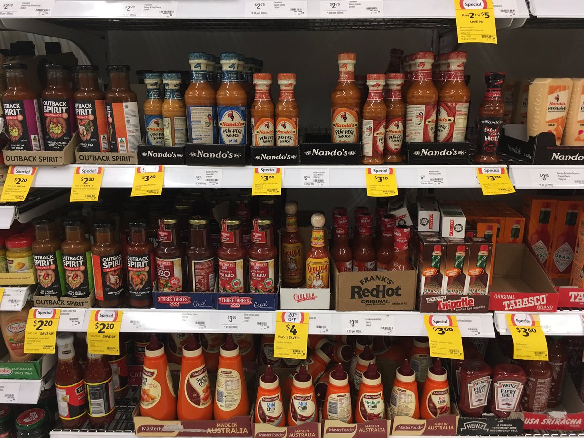 Saucedrop's tweet photo. Your average supermarket hot sauce shelf in Australia https://t.co/HB7PjtxTzd