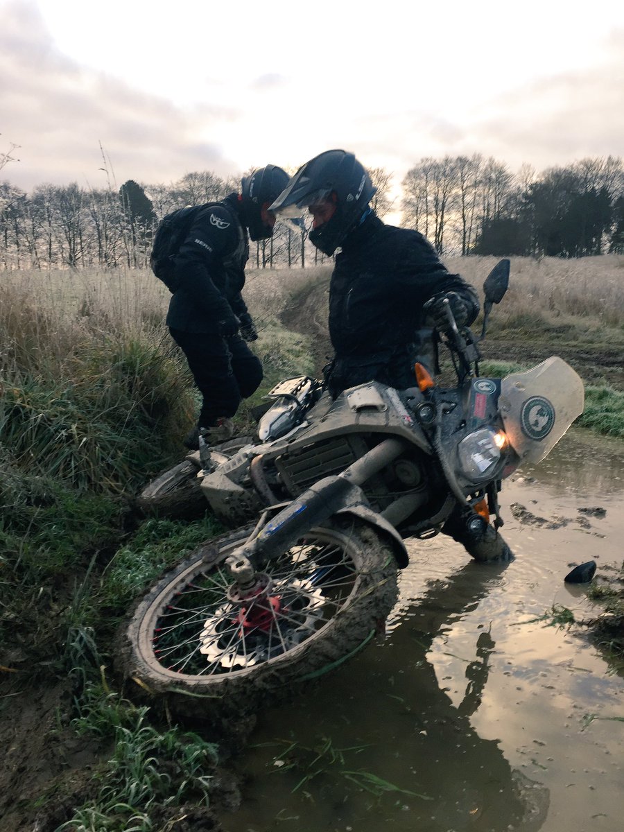 ArmyMotorAdv's tweet photo. Lee perfectly demonstrating how to dismount into the only pool of frozen mud for miles around. #transamericas #motorcycle #expedition https://t.co/onf0579G6e