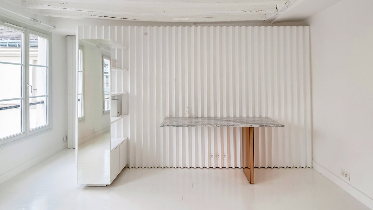 dezeen's tweet photo. Ubalt Architectes creates compositions with custom furniture in minimalist Paris flat: https://t.co/TuygDMEZm4 https://t.co/C5Db0arhuU