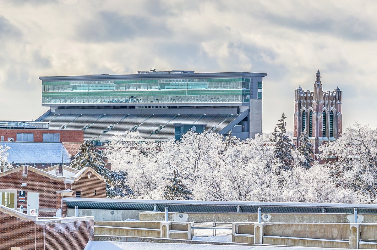 CityofEL's tweet image. We love this winter shot of Beaumont Tower and #Spartan Stadium! Photo by Dane Robison, 2016 East Lansing Community Photo Contest, 1st Place