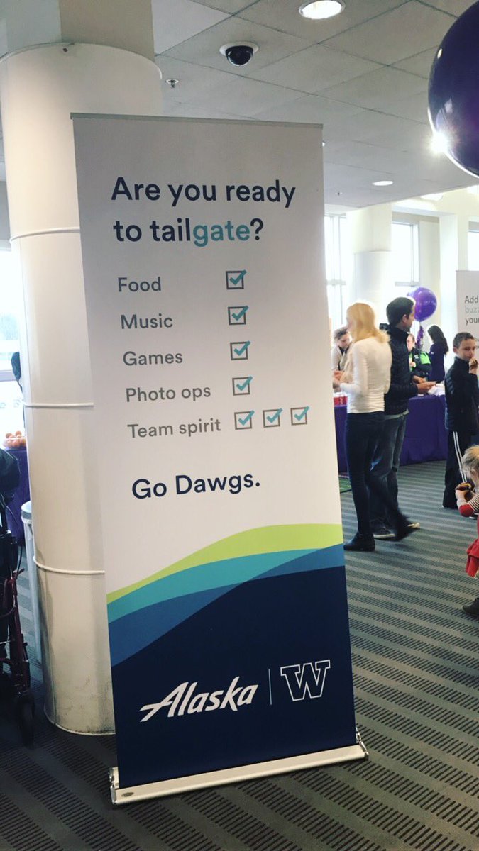 AlaskaAir's tweet image. It's a tailgate party at @SeaTacAirport to send off @UW_Football fans to Atlanta! #WiththeDawgs #GoHuskies  #CFBPlayoff