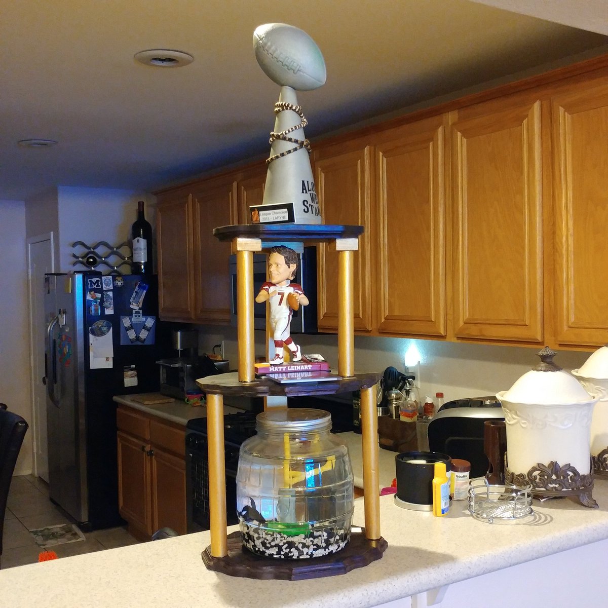 toddmaracle's tweet photo. Our beta fish "Django", Matt Leinart and the mini Lombardi going on 7 yrs of fantasy glory #myfantasytrophy #the_D_League #LasVegas https://t.co/BmaIZsbKz8