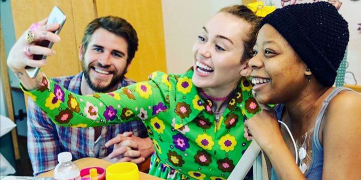 people's tweet photo. Miley Cyrus and Liam Hemsworth make ‘very special’ visit to sick kids at children’s hospital https://t.co/O9FbFg1jM6 https://t.co/gOigXJReIh