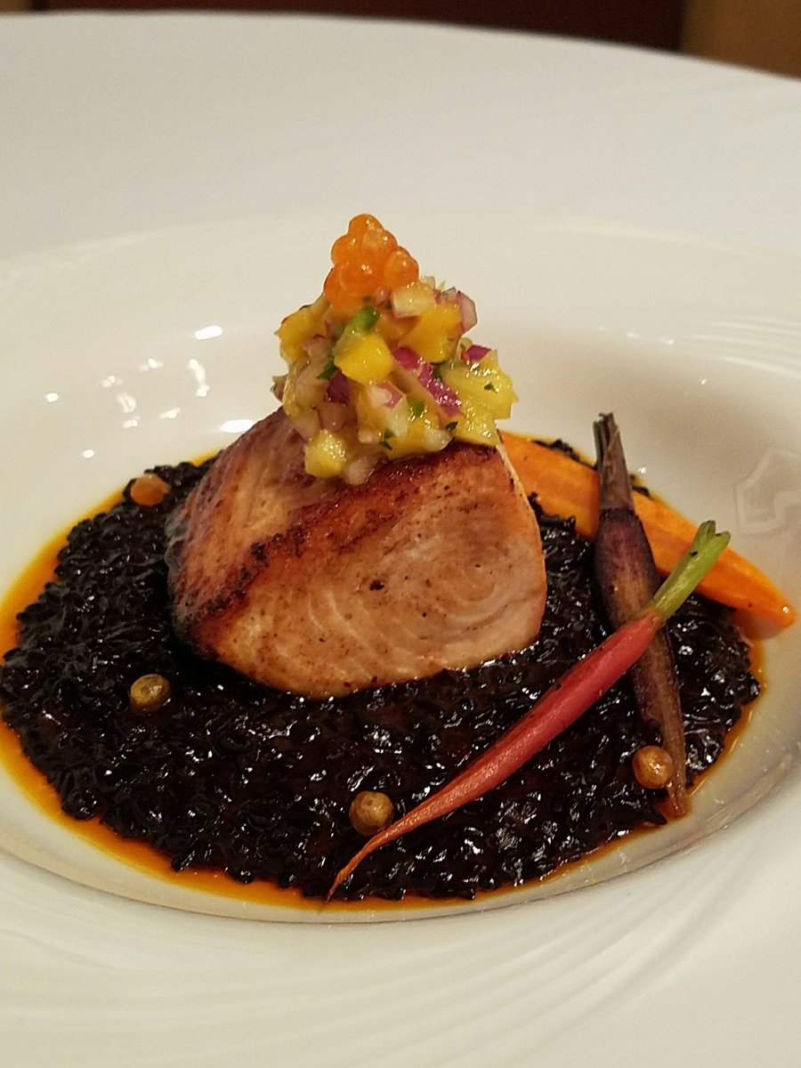 Honey glazed Ono, forbidden black rice risotto topped with mango salsa and finished with tricolor carrots and salmon roe