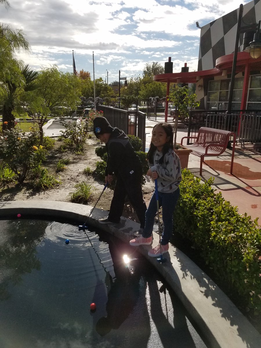 Miniature golf is more fun with puddles!