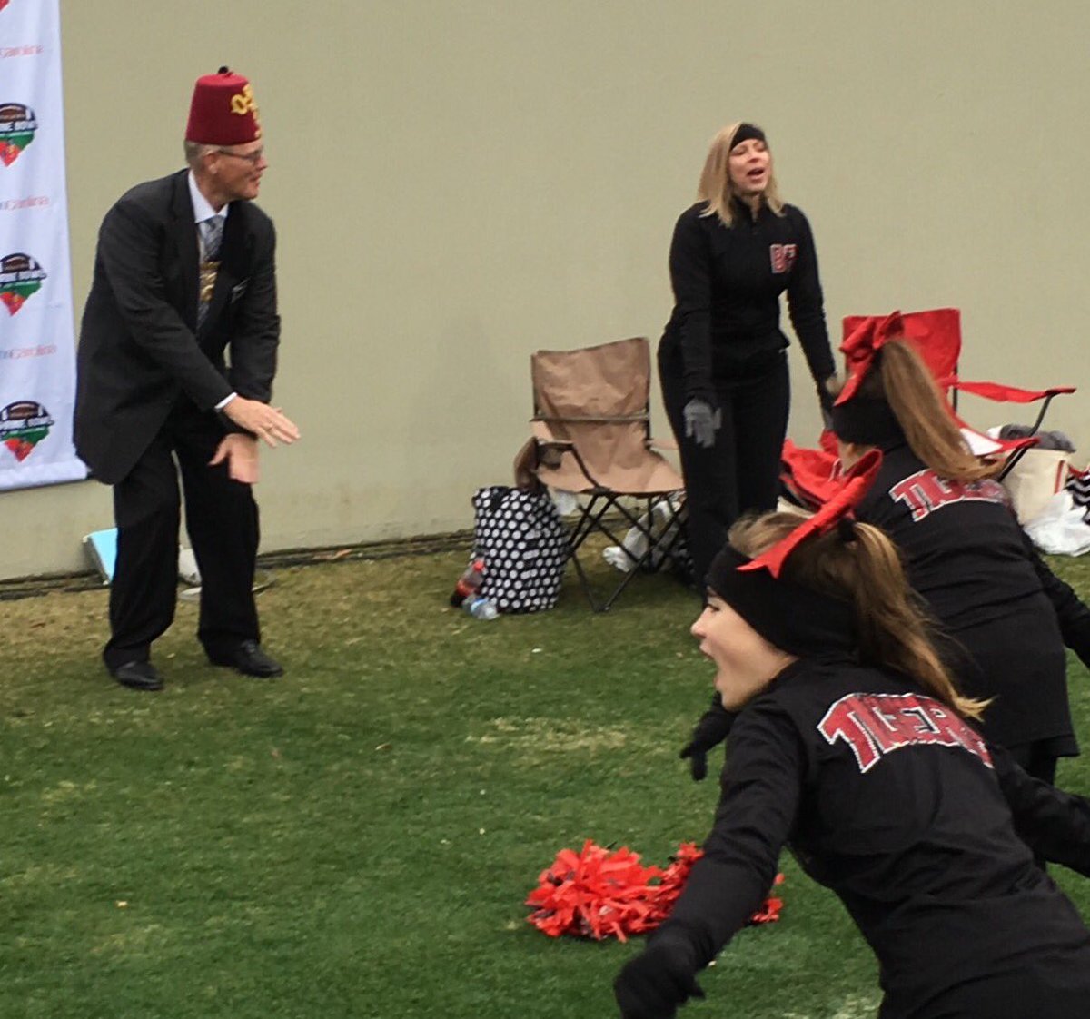 shriners's tweet photo. Imperial Sir Bill Bailey has the spirit! Cheering at the 80th Shrine Bowl of the Carolinas on 12/17/2016. @shrinershosp @SHCGreenville https://t.co/xDJoJuP4um