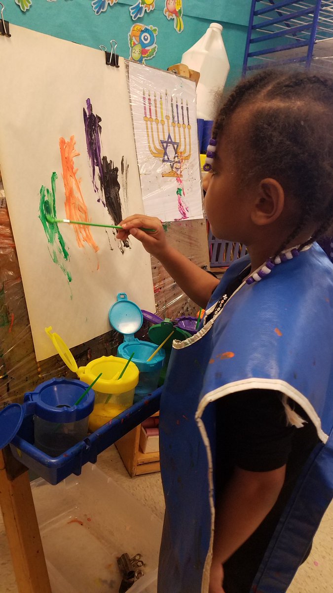 MsLammatPlayer's tweet photo. Caylee looks at the example as she paints her Menorah. #Hanukkah is one of the many holidays we are learning about this week. @PlayerSchool https://t.co/dwqoqhyYUz