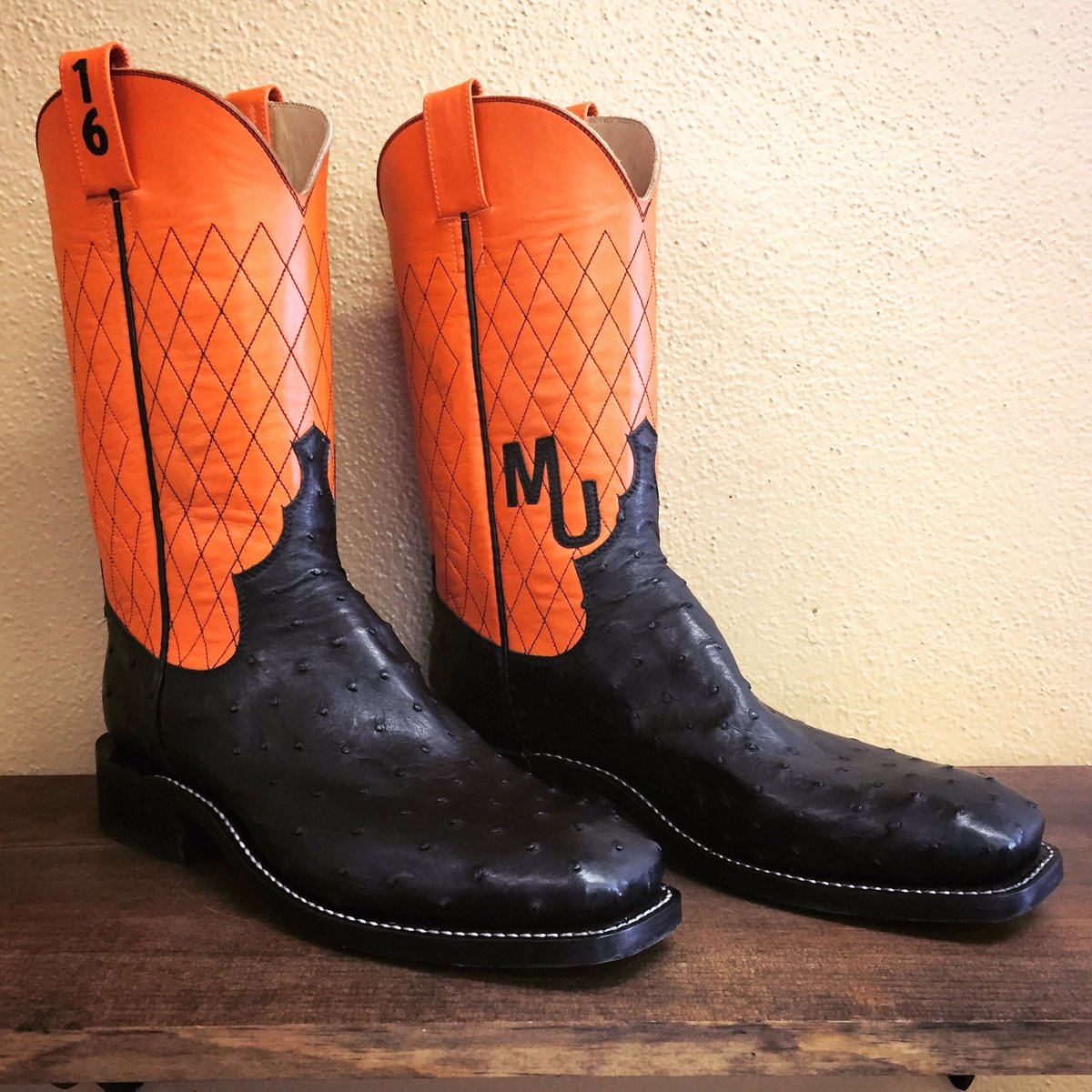 orange and black cowboy boots