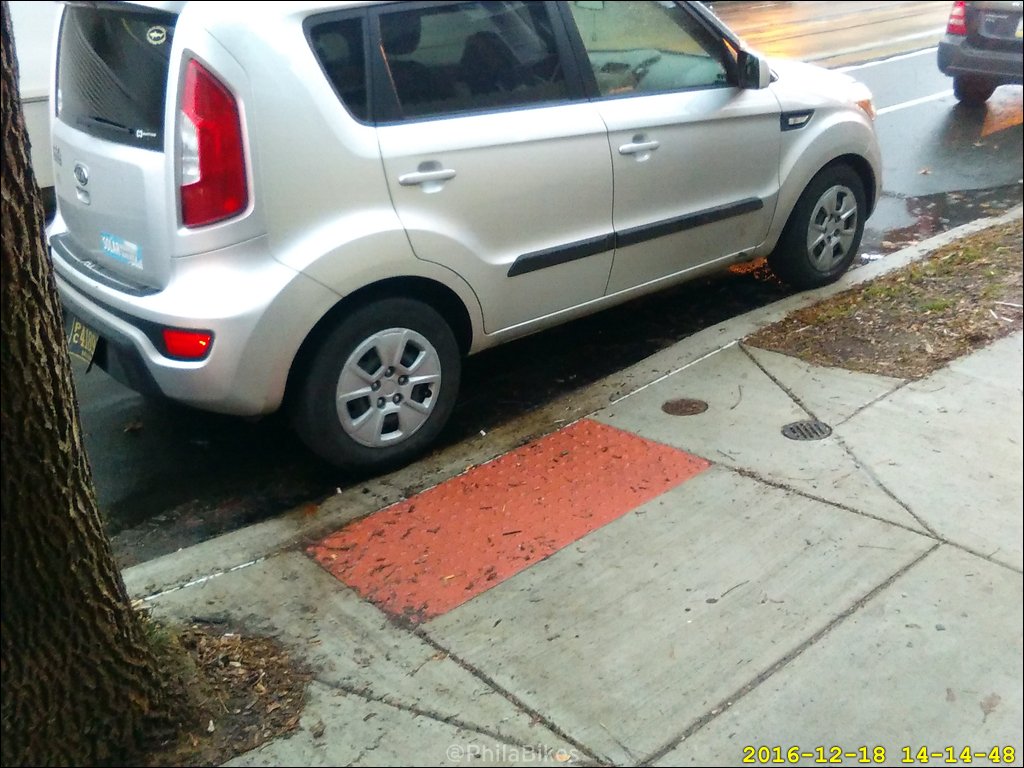 Time and money well spent! Mid-block curb ramps with no crosswalk or light. #walkPHL #accessibility
