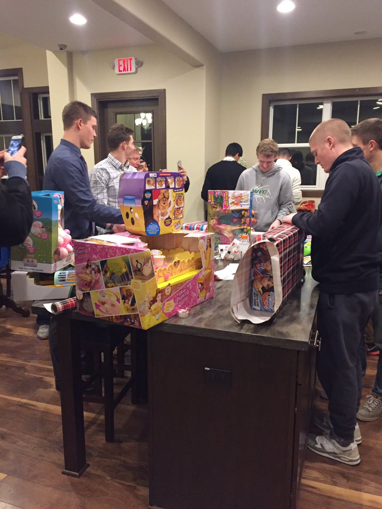 Men's basketball team helping the kids at Children's Hospital of Wisconsin.
