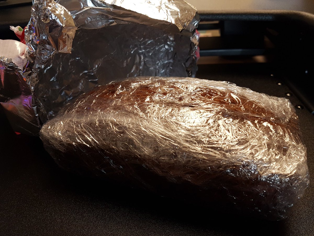 PrincipalSR's tweet photo. Banana bread wrapped in duct tape.  Secret Santa's are the BEST! #CESCoyotes https://t.co/fWtodwp6LA
